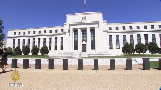U.S holds interest rates steady, warns hikes ahead