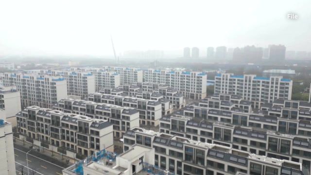 Beijing may buy unsold homes to help market